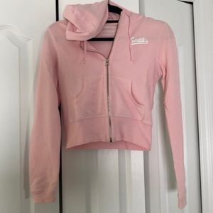 Smith’s pink zip-up hoodie